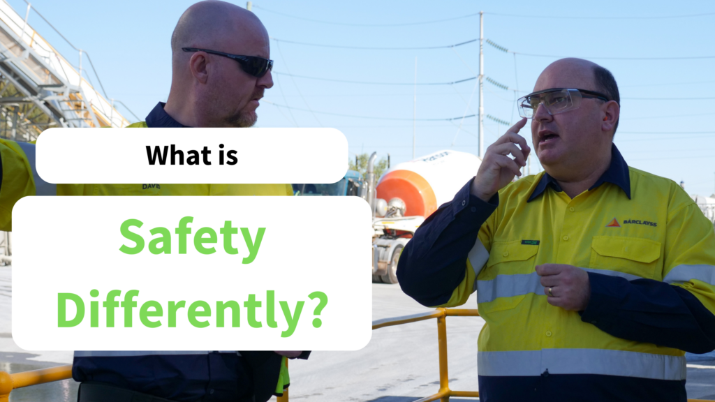 Text says: What is Safety Differently? Two men wearing high vis and safety goggles.